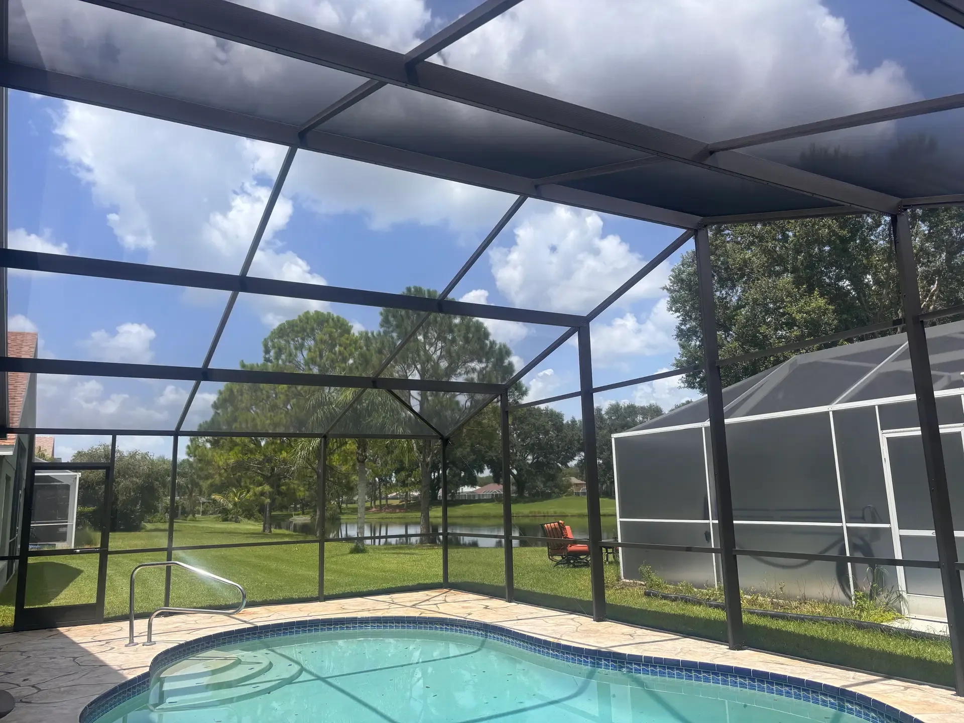 Cheval pool enclosure after restoration, with dark frame and refreshed screen.